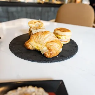 a croissant sandwich on a plate