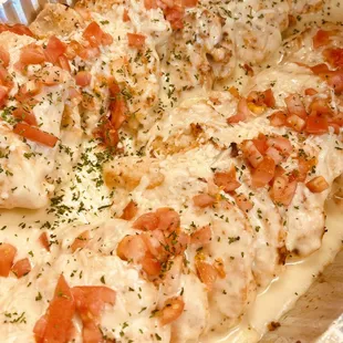Chicken Asiago, with a light creamy cheese sauce, fresh tomato garnish