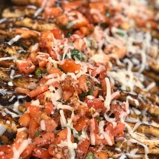 Summer Caprese Chicken, Grilled and Garnished with fresh tomato, basil &amp; mozzarella cheese