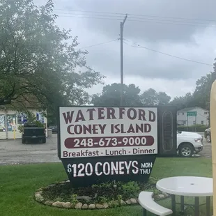 a picnic table and a sign