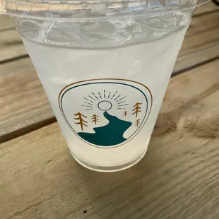 a plastic cup with a drink in it