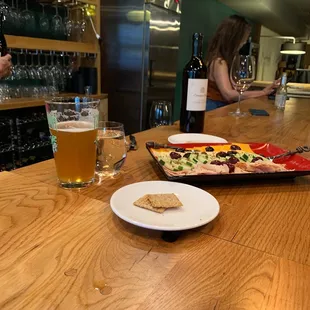 a plate of food and a glass of beer