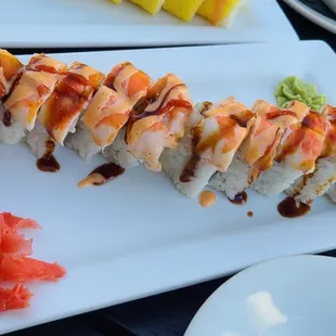 a plate of sushi and a plate of salmon