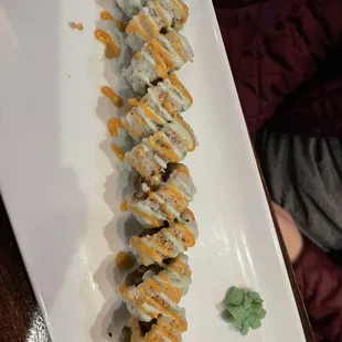 a plate of sushi rolls