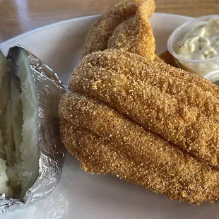 Fried fish with a baked potato