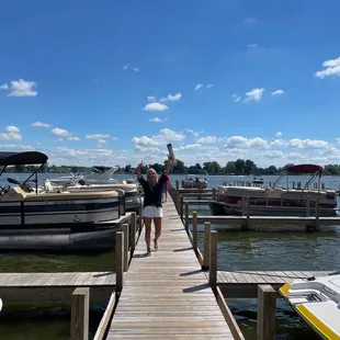  woman walking on a dock