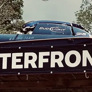 n old car on top of a sign