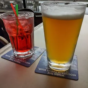 two glasses of beer and a drink