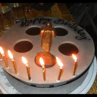Happy Birthday to me! This is my movie reel cake...Yellow cake with chocolate layering, fondant top and buttercream stars.