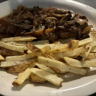 Hamburger Steak with onions and mushrooms and light gravy with homemade fries.