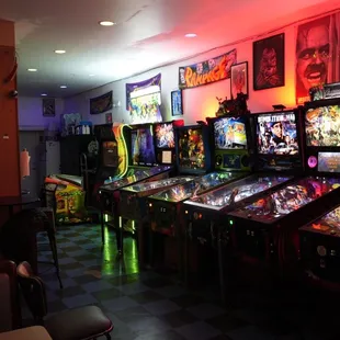 a row of pinball machines