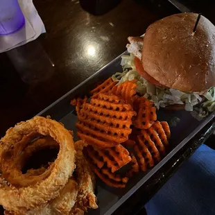 Original chicken sandwich, half onion rings and half sweet potato fries