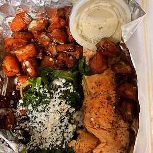 Salmon Special - a huge portion of perfectly cooked salmon, lovely roasted sweet potatoes, steamed spinach and a lovely sauce.