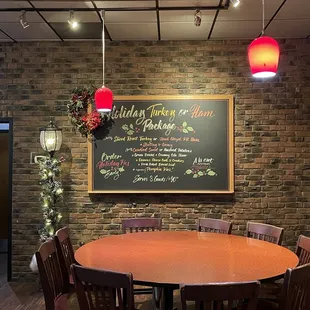 Info on chalkboard about ordering Christmas family meals with decor