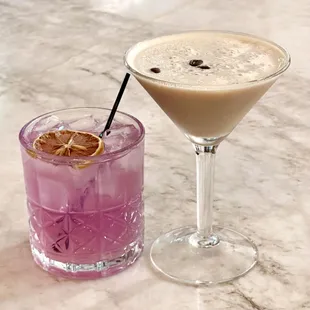 two cocktails on a marble table