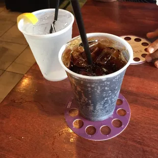 Plastic... at least you know the cups are clean!
