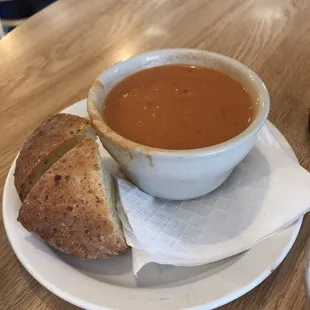 Tomatoe bisque soup with 2 slices of homemade focaccia bread.