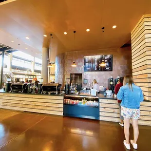 a woman standing in front of the counter