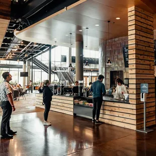 two people standing in a coffee shop