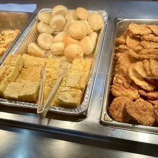 Pork chops, cornbread, rolls, and catfish