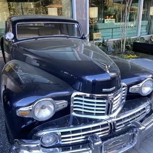 Old Car in front of hotel