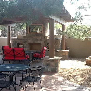 a patio with tables and chairs