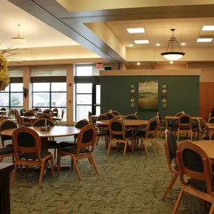 a restaurant with tables and chairs
