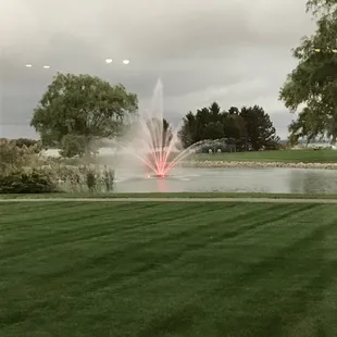 a fountain in the middle of a field
