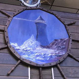 a painting of a ship&apos;s wheel