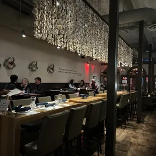 people sitting at tables in a restaurant