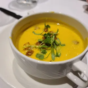 a bowl of soup on a plate