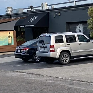 two vehicles parked in a parking lot