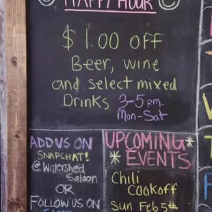 a chalk board with happy hour specials
