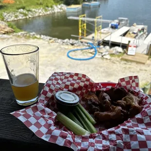 Wings and beer and lake view.