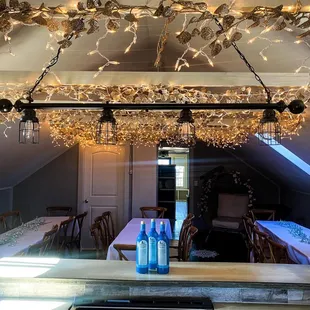 a long dining table with bottles of water