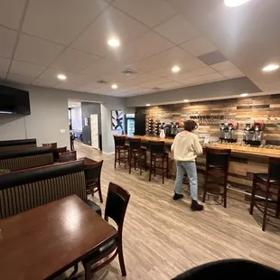 a man standing at a bar