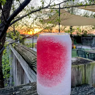 a drink in a glass on a wooden table