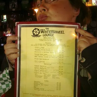 Sara holding up the menu for me to take a pix.