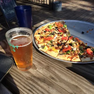 This pizza is delicious and the beer is a cold IPA in a frosty glass. And we are sitting in the sunshine. Best day ever. I love this place!