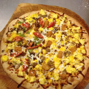 a pizza on a wooden board