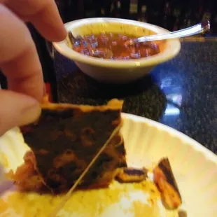 The burnt pizza we received.