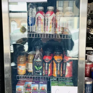 a fridge full of drinks and beverages