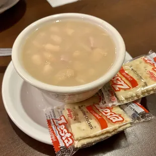 a bowl of soup and crackers