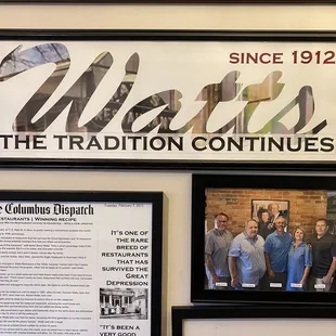 a group of framed photos of the restaurant