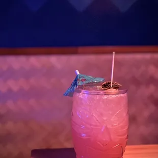 a pink drink in a glass