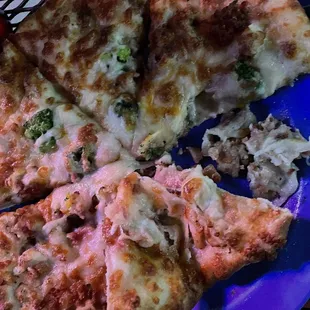 a slice of pizza on a blue plate