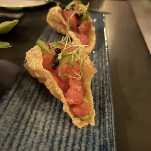 a close up of a plate of sushi