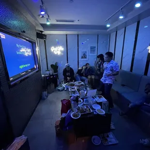 a group of people in a living room