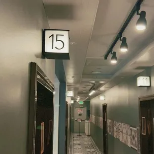 a long hallway with a clock on the wall