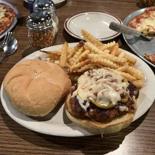 Italian sausage with melted mozzarella cheese on a kaiser roll